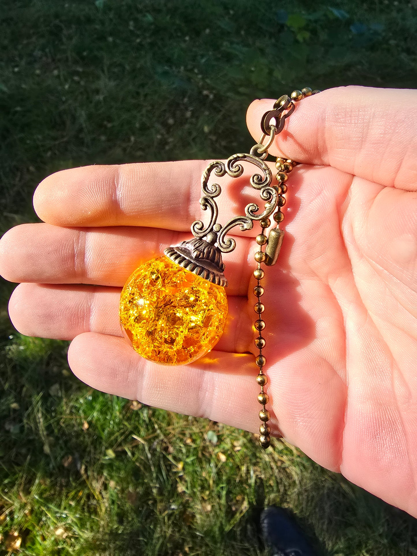 Suncatcher Pendant with Crackled Quartz and Antique Metal Design