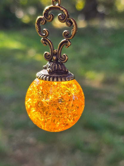 Suncatcher Pendant with Crackled Quartz and Antique Metal Design