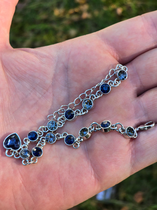 Silver-colored bracelet with blue rhinestones